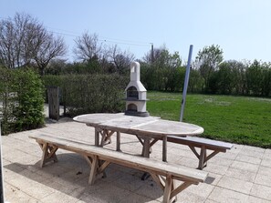 Outdoor dining - La Grange, on one level, 4 stars for 8 people at Gîtes Les Grandes Chaum (Chambon)