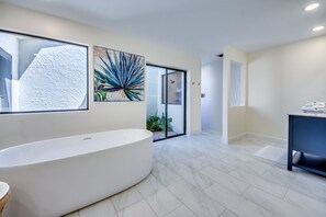 Combined shower/tub, hair dryer, towels, soap