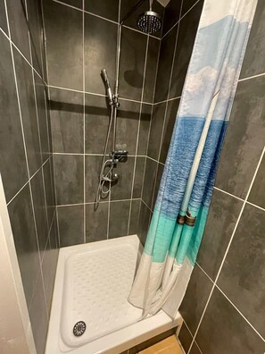 Shower, eco-friendly toiletries, hair dryer, towels