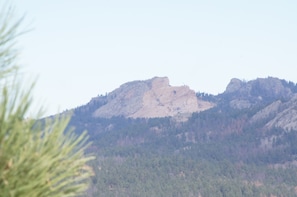 A mountain with a rocky peak and dense forest. - Elk Haven Vacation Cabins, Custer SD, Elk Haven Vacation Cabins, Custer SD (Custer)