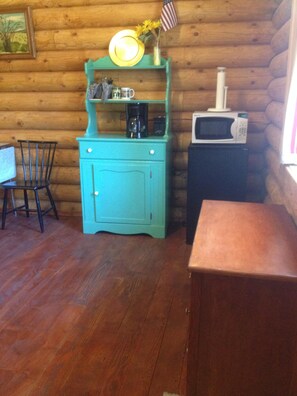 Kitchen table and chairs, cabinet, mini fridge, microwave, coffee pot and more