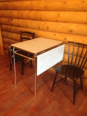 Vintage table and chairs for comfortable dining.