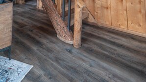 A wooden interior with a staircase, wooden walls, and a wooden floor. - Disconnect From Technology And Reconnect With Nature - Sleeps 6 (Lake City)