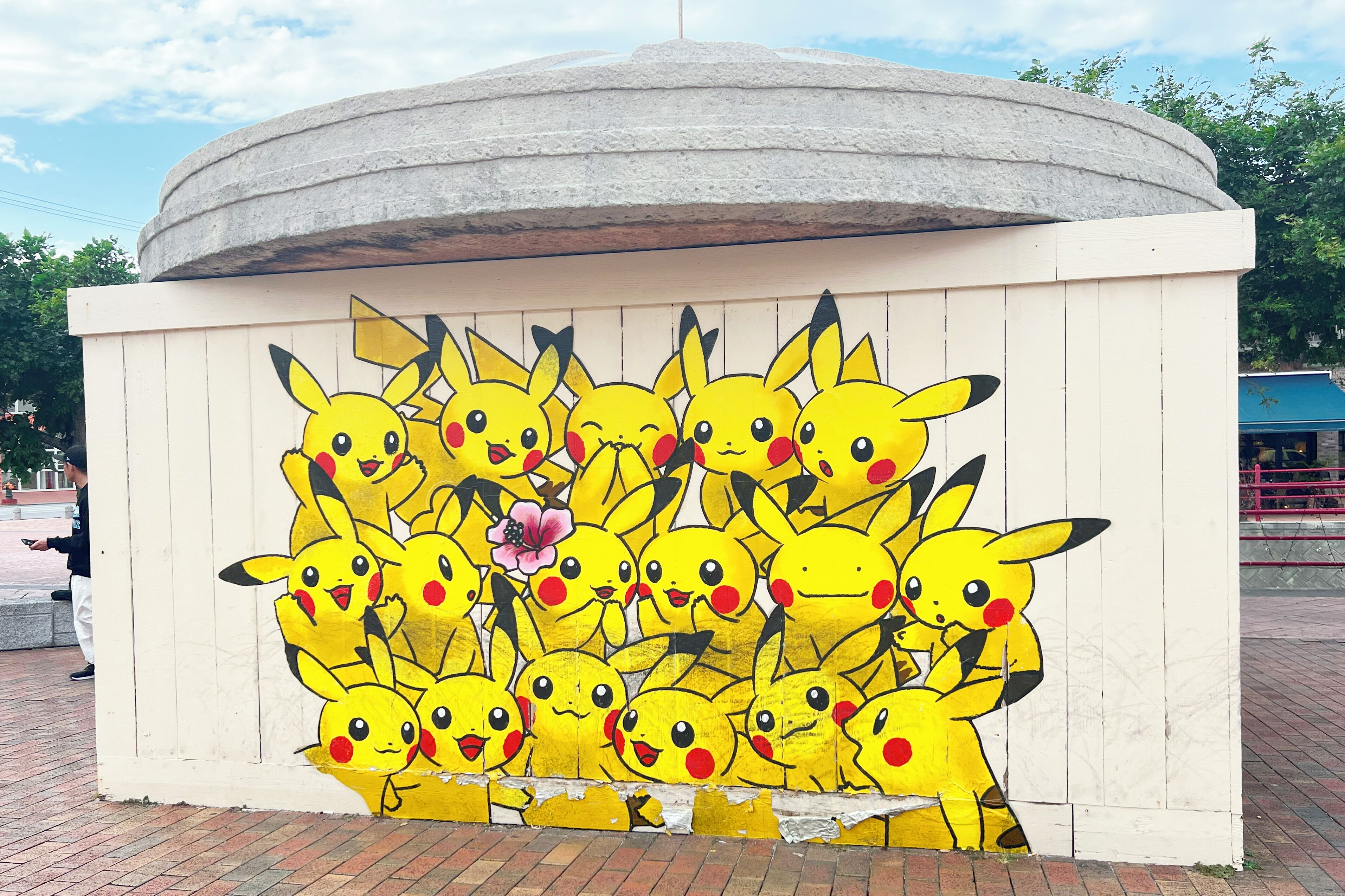 A wall with a Pikachu mural.