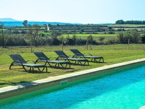 Relax by the pool surrounded by serene views of the rolling hills.