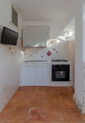 Fridge, stovetop, coffee/tea maker, dining tables