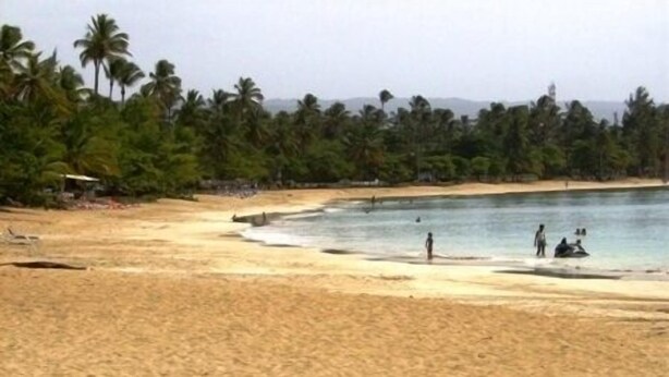 A beach with clear water, palm trees, and a few people. - Luxury retreats, destination weddings, family reunions and social events (Las Terrenas)