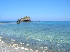 A clear coastal area with rocky formations and calm waters. - Paphos: superb 1-bedroom apartment in seaside tourist area sleeps 2 (Kato Paphos)