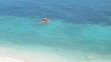 On the beach, sun-loungers