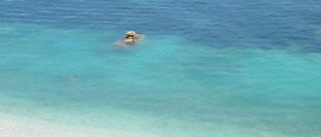 On the beach, sun-loungers