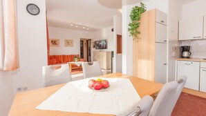 A modern kitchen with white cabinets, a coffee machine, and a sink. - Apartment bay view with great sea view in Porec, only 300m from the beach (Porec)