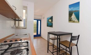 Fridge, stovetop, dining tables