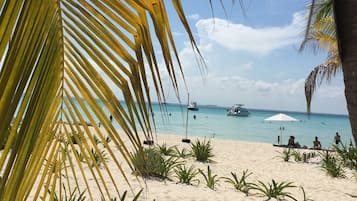On the beach, sun-loungers, beach towels