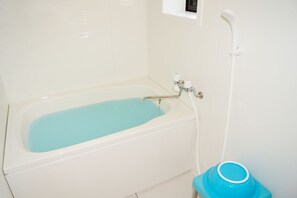 A bathroom with a bathtub, a shower, and a blue basin. - Sunny coast minamiboso ocean blue (Minamiboso)