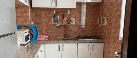 Microwave, coffee/tea maker, cookware/dishes/utensils