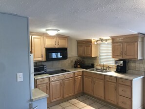 Enjoy cooking in this well-equipped kitchen with a microwave, toaster, and coffee maker.