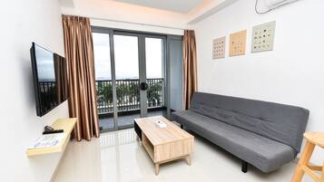 City Apartment (LOVINA 6-12) | Living area | 43-inch Smart TV with satellite channels, TV