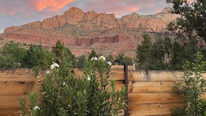 A wooden fence with a view of a mountainous landscape under a colorful sky. - OBSERVATION POINT- 2 Miles from main entrance to ZNP New Barrel Sauna by river (Springdale)