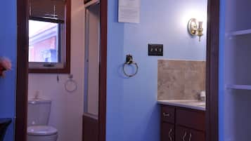 Shower, hair dryer, towels, toilet paper