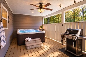 A deck with a hot tub, a grill, and a ceiling fan. - Private Hot Tub & Fireplace, 2 Miles from Asheville (Asheville)