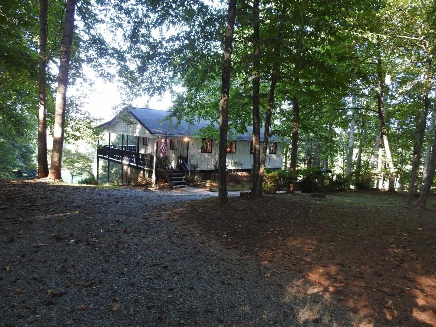 Serene and secluded mountain side retreat home next to The French Broad River.