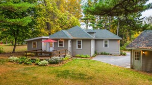 A single-story house with a covered patio, a front door, and a driveway.