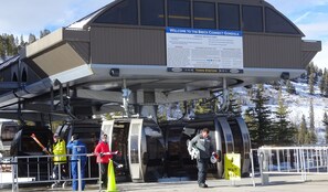 Ski lift station with a modern design and clear signboard for the Breck Connect Gondola.