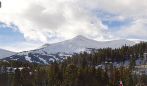 Une montagne enneigée, sous un ciel dégagé, avec la date du 18/01/2016.