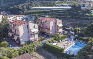 Relax by the rooftop pool surrounded by scenic vineyards and enjoy the views from the balconies.