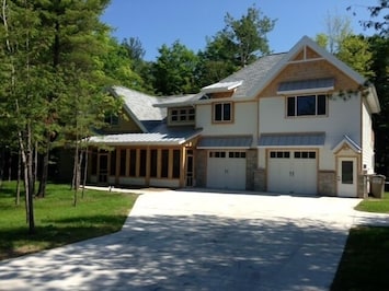 Picture of the entire home. This two bedroom unit is on the right side (upper).