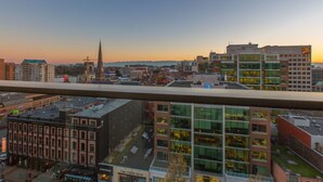 A cityscape with a prominent church spire, modern buildings, and a mix of commercial and residential structures. - EraBella-Downtown 12th floor Beauty, Free Parking and Wifi, Close to Everything by Victoria Prime! (Victoria)