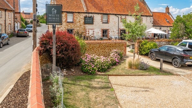 A traditional building with a sign reading 'White Horse,' a paved driveway, and a gravel area. - Saltmarshes, Holme-next-the-Sea, Norfolk (Holme-next-the-Sea)