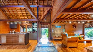 A modern interior with a kitchen, dining area, and living space.