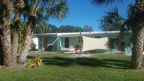 Enjoy a relaxing stay in this charming home with a covered porch, perfect for unwinding.