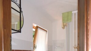 A compact bathroom with a sink, toilet, and shower. - Villa Paradisino Orbetello, Bilocale Flamingo B (Orbetello)