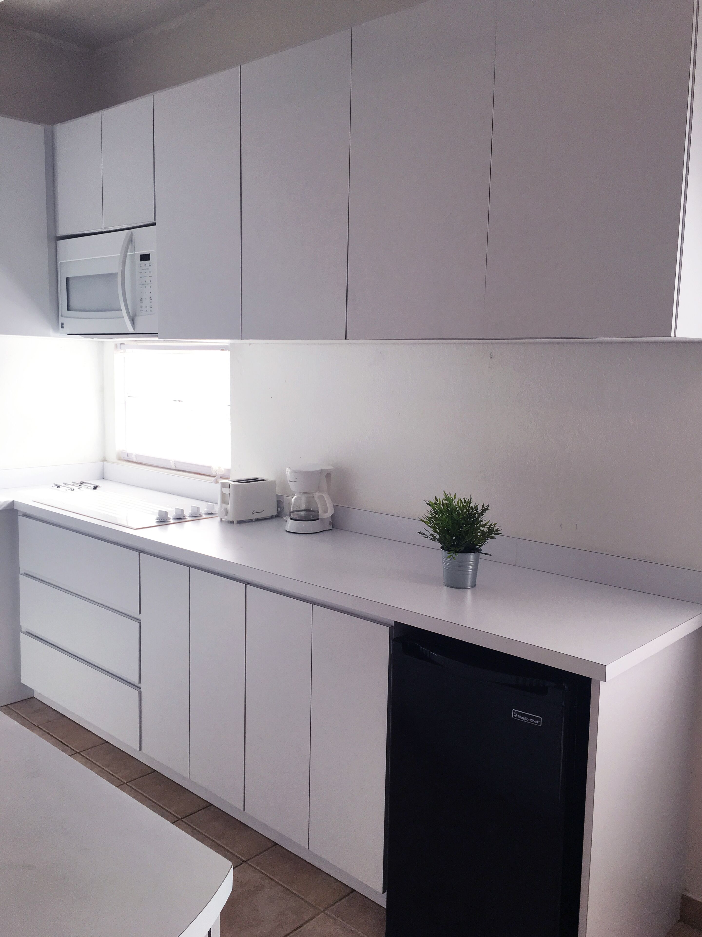 Fridge, microwave, stovetop, coffee/tea maker