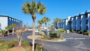 Stylish hotel with modern architecture, landscaped gardens, and ample parking.