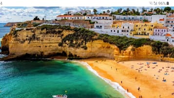 On the beach, sun-loungers, beach towels