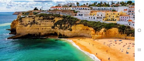 On the beach, sun-loungers, beach towels