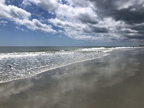 On the beach, sun-loungers