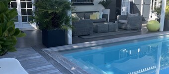 Grand Standing air-conditioned family home with heated spa pool and sauna.