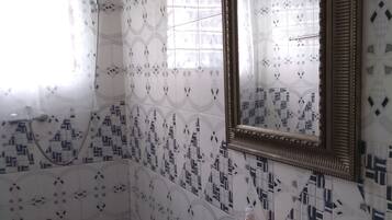 Shower, towels, soap, toilet paper