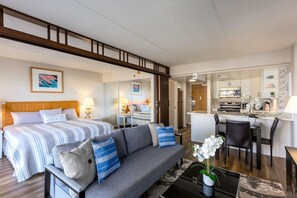 A hotel room with a bed, a sofa, a dining area, and a kitchen. - 1519 · Ilikai Collection # 9. Beachfront Resort, upgraded (Honolulu)