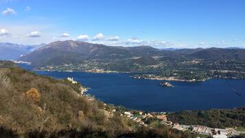 A coastal town with a view of the sea and mountains.