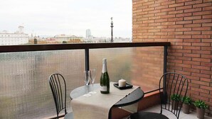 A balcony with a table set for two, a bottle of wine, and two glasses. - Incredible apartment-central-sea view-near the beach-Free Wifi. (Barcelona)