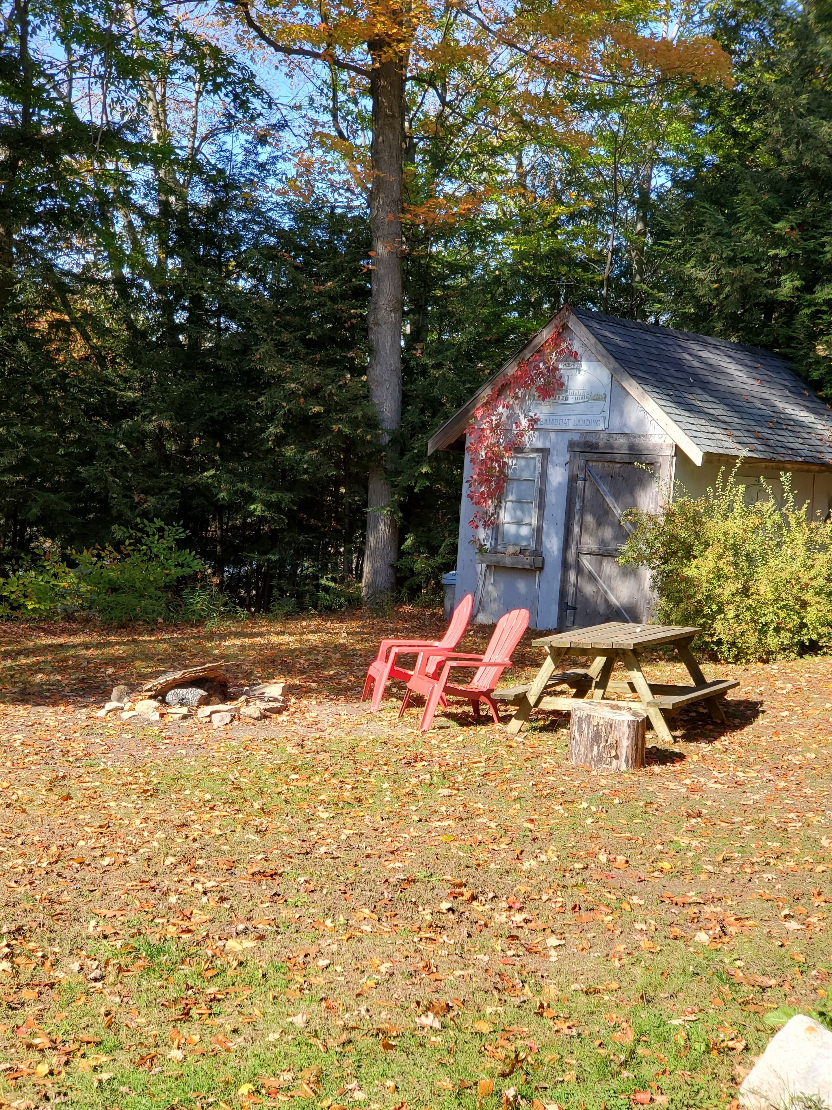 A rustic cabin with a wooden exterior and a small porch area.