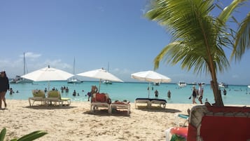 On the beach, sun loungers, beach towels