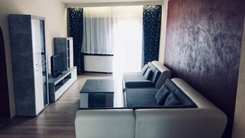 Family Apartment, 3 Bedrooms, Non Smoking | Living area | Flat-screen TV