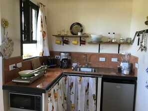 Fridge, microwave, stovetop, coffee/tea maker