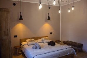 Deluxe Room, Private Bathroom | 1 bedroom, blackout curtains, soundproofing, iron/ironing board
